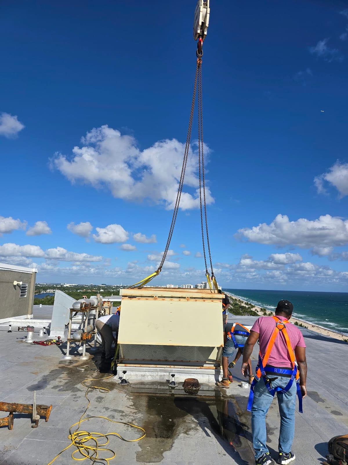 Lift — breaking the old unit off the curb